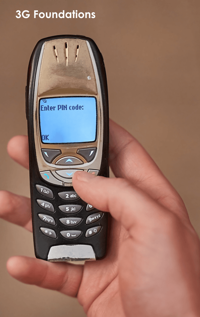 Person holding an older model nokia-style cell phone